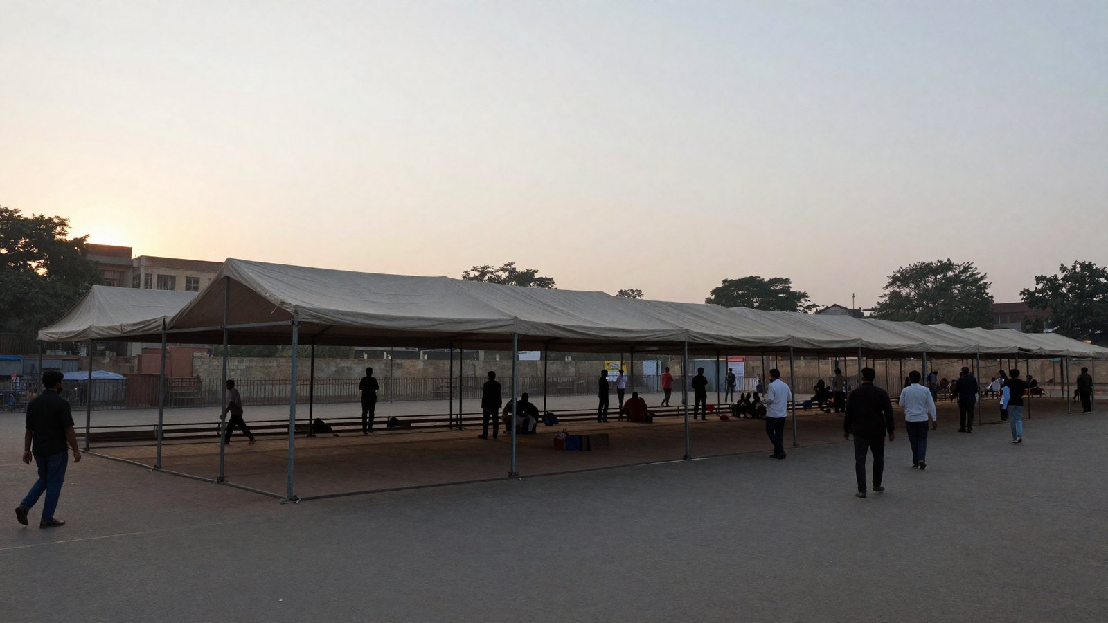 An empty protest tent being cleared at dawn at a Delhi demonstration ground after a hunger strike ends