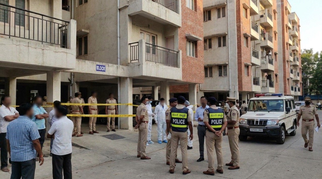 Police investigation outside an apartment block in KR Puram, Bengaluru where three members of a family were found dead
