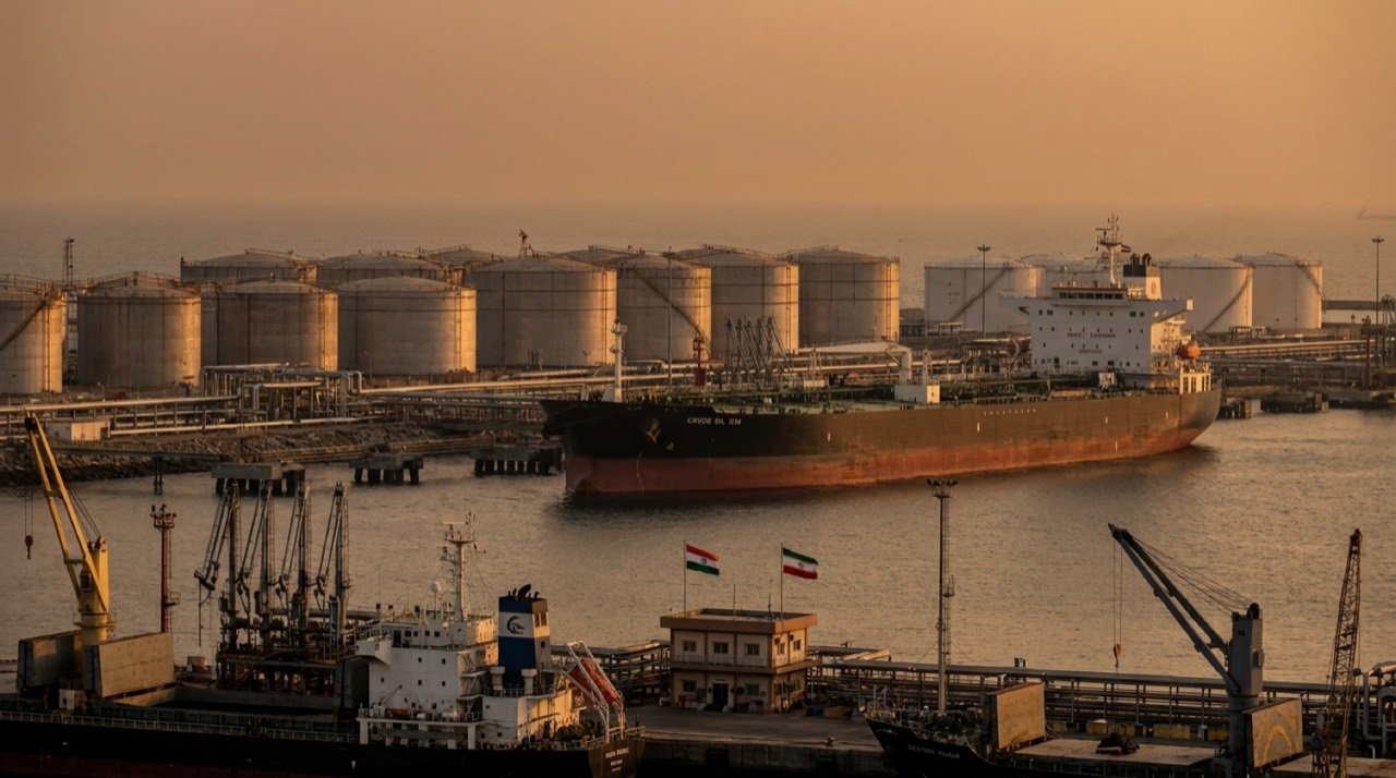 Crude oil tanker and refinery storage tanks illustrating India-Iran oil trade discussions