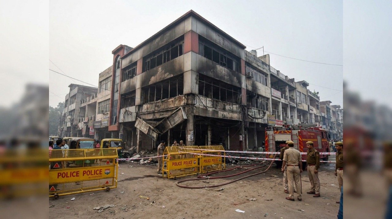 Fire-damaged commercial building in Lucknow's Aliganj area sealed off by police after a deadly blaze