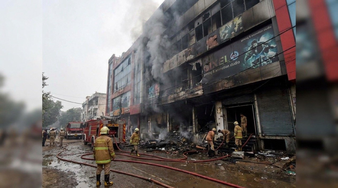 Firefighters at the site of a deadly blaze in a Lucknow commercial building housing a gaming and animation studio