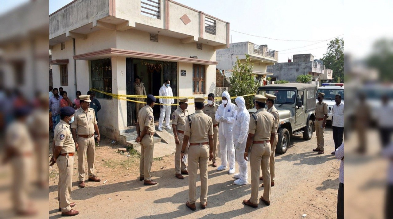 Police personnel and forensic team outside a residential home in Nalgonda, Telangana, during an investigation