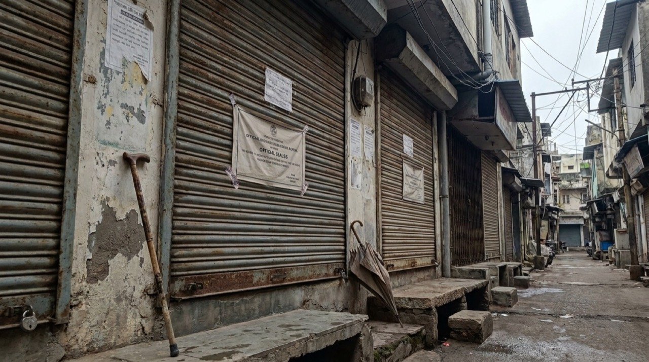 Sealed shop shutters in Surat symbolising the civic dispute behind an elderly couple's euthanasia plea