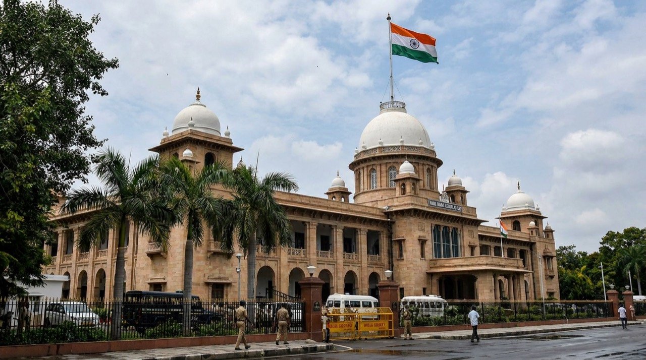 The Tamil Nadu Legislative Assembly building in Chennai with the state flag flying.